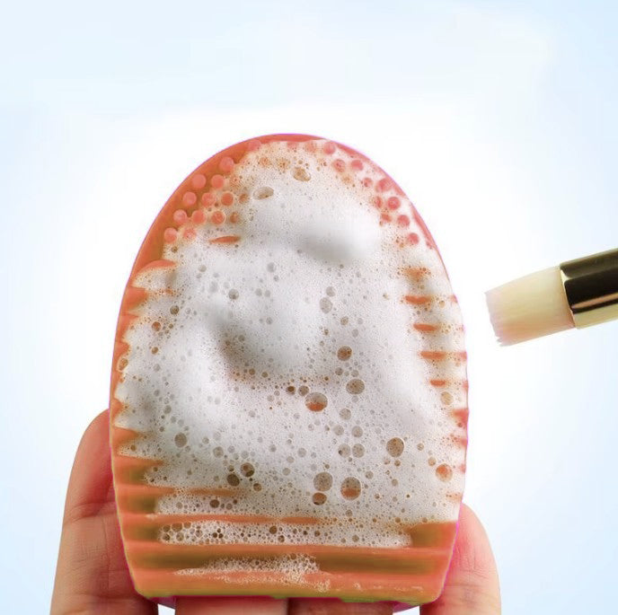 Accesoriu din silicon, UBX®, pentru curatarea pensulelor machiaj, 7x5x3cm, portocaliu Accesoriu din silicon, UBX®, pentru curatarea pensulelor machiaj, 7x5x3cm, portocaliu